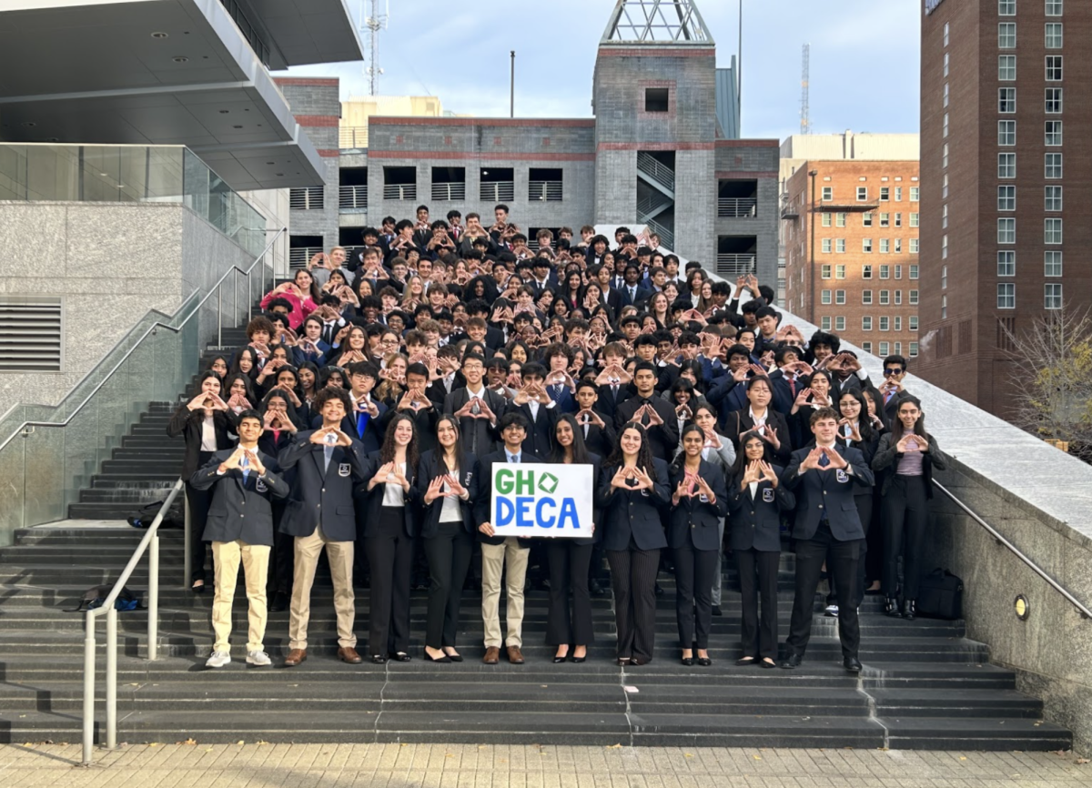 Nearly the entire Green Hope DECA chapter holds up the “DECA Diamond” before entering the Convention Center to compete at Districts.
